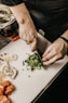 person slicing vegetable