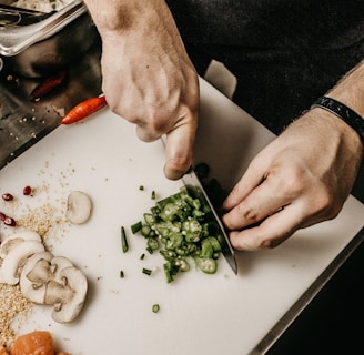 person slicing vegetable