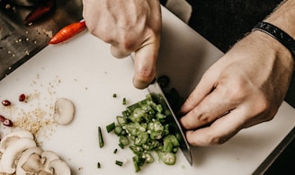 person slicing vegetable