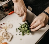 person slicing vegetable