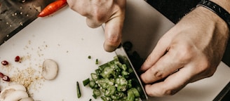 person slicing vegetable