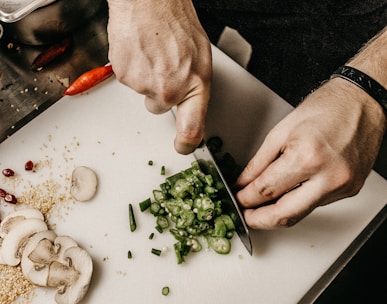 person slicing vegetable