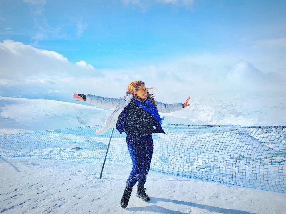 woman wearing white jacket across clouds