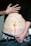 A person's torso with a prominent vertical scar down the middle of the abdomen. There are various words written around the scar, such as confusion, hope, inclusion, function, presence, fight, repair, pain, healing, redemption, fear, and loss. The person is holding up their shirt to reveal the scar and the words, and they are wearing jeans and patterned underwear.