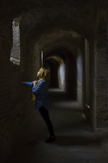 woman leaning hand on wall