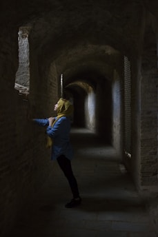 woman leaning hand on wall