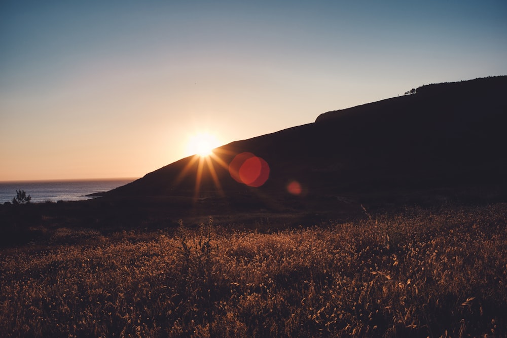 silhouette of mountain during golden hour