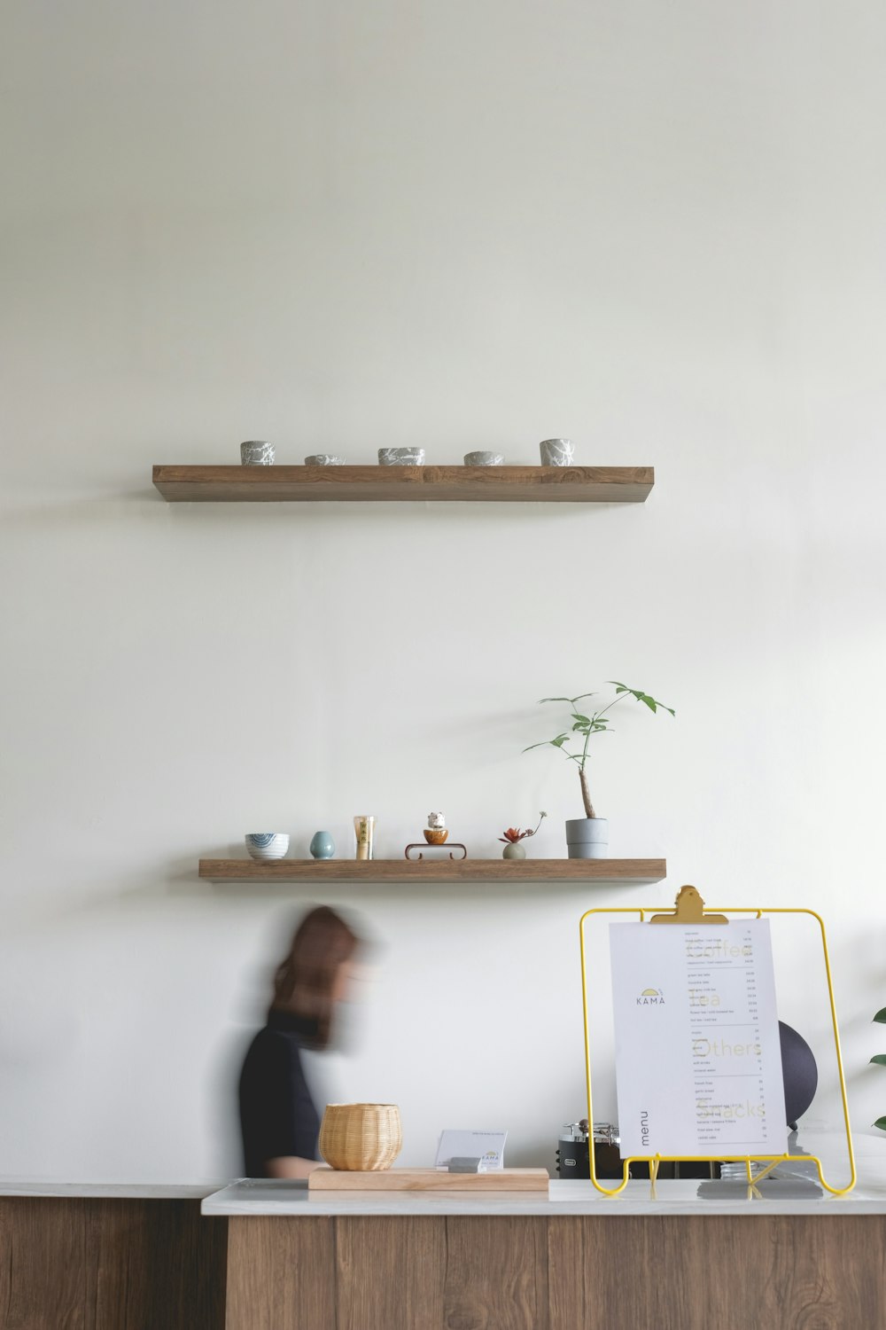 a person sitting at a desk in a room