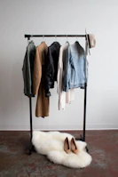 five jackets on clothes rack