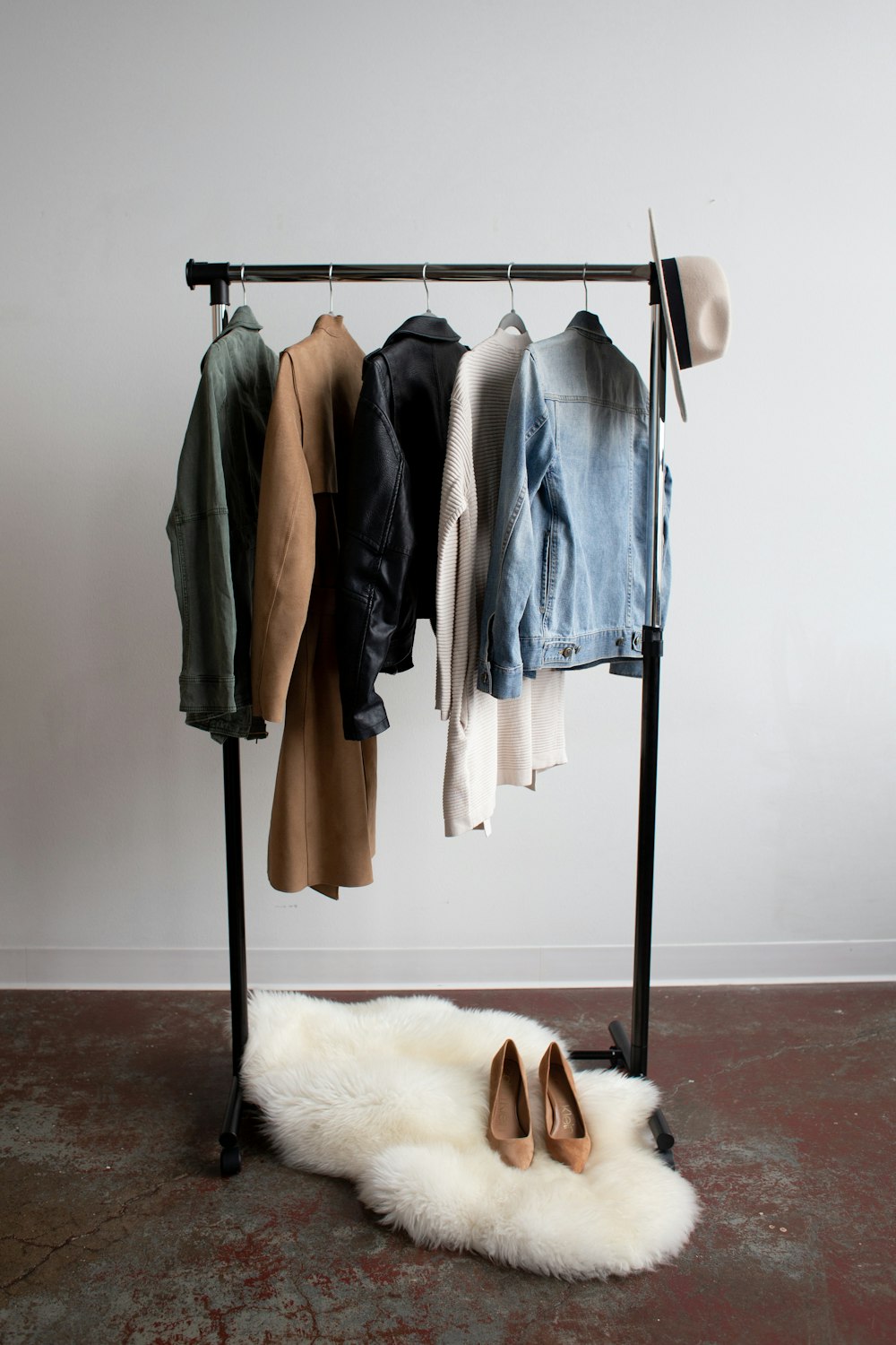 five jackets on clothes rack