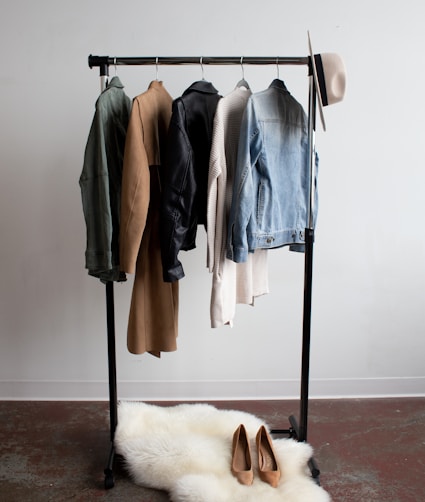 five jackets on clothes rack