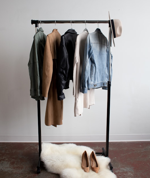 five jackets on clothes rack