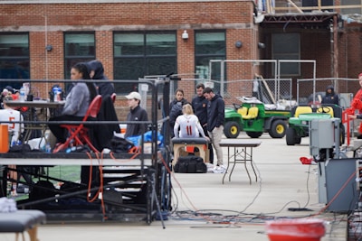A group of sports science specialists working together in a training facility with young athletes.