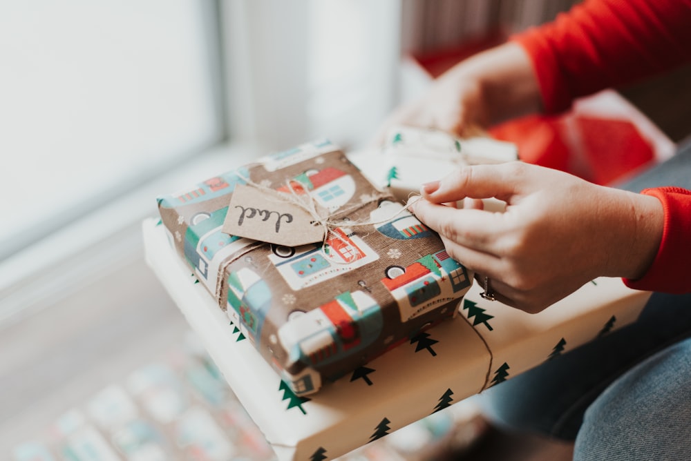 person holding gift box