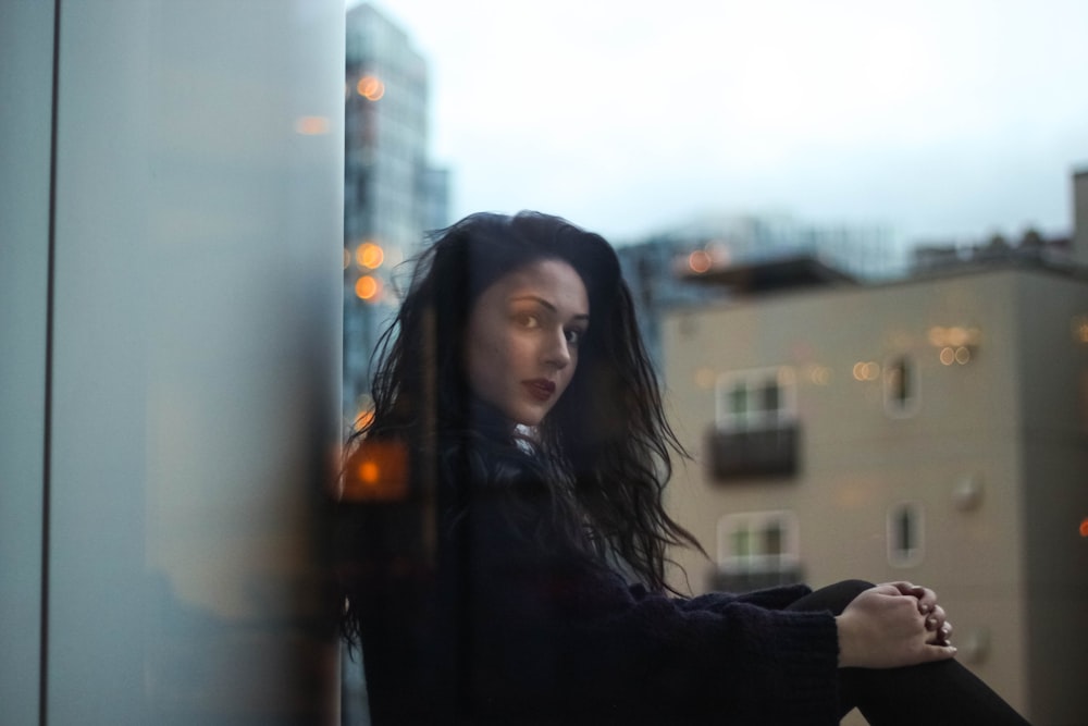 woman leaning on wall