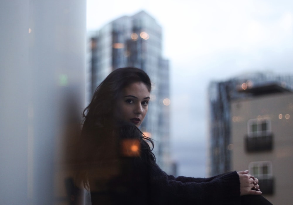 woman leaning on wall