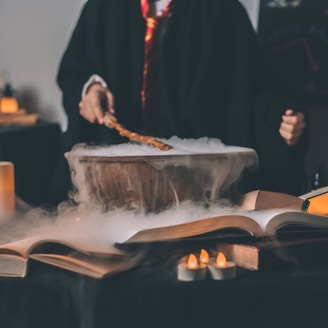 person holding wand on top of bowl