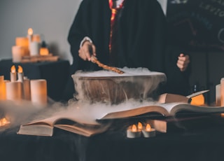 person holding wand on top of bowl