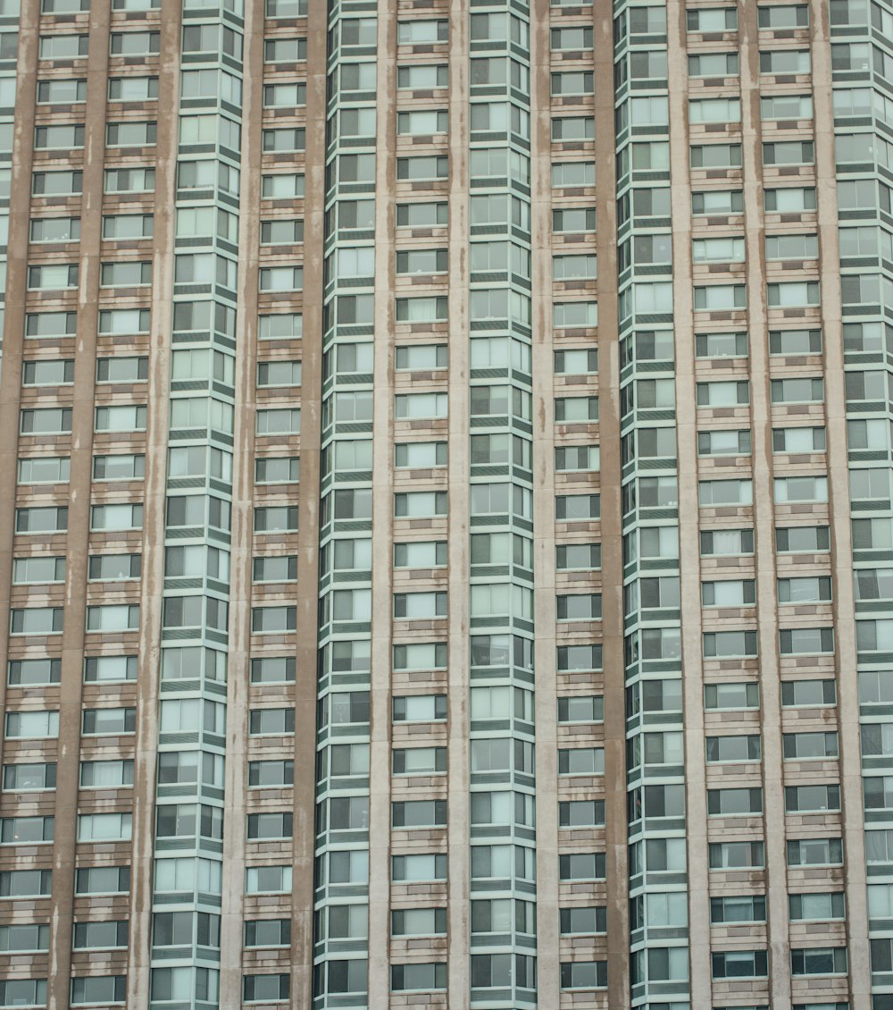 low-angle photography of gray concrete high-rise building during daytime