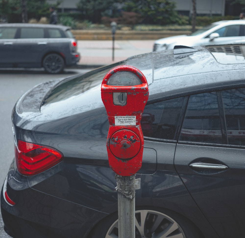 red and gray parking meter
