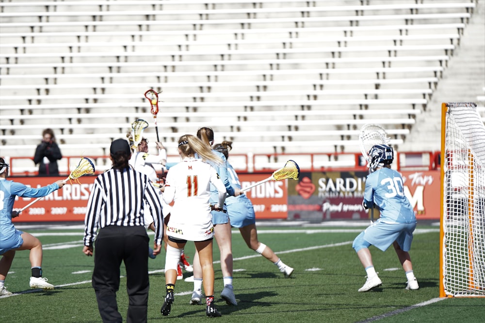 group of person playing lacrosse