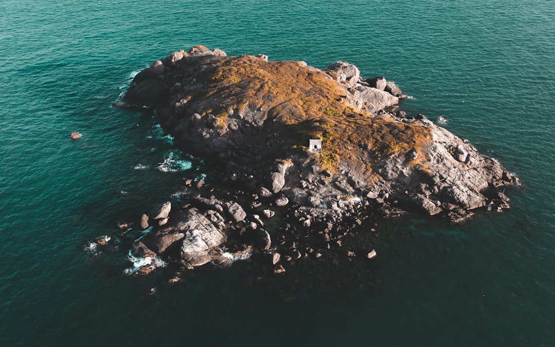 rocky islet during daytime