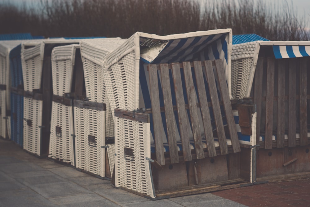 white-and-brown folding benches with canopies