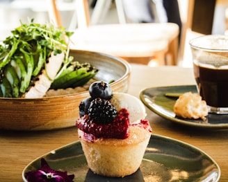 cupcake with berry toppings on plate