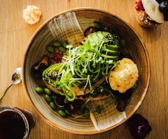 green beans and vegetable salad on brown bowl