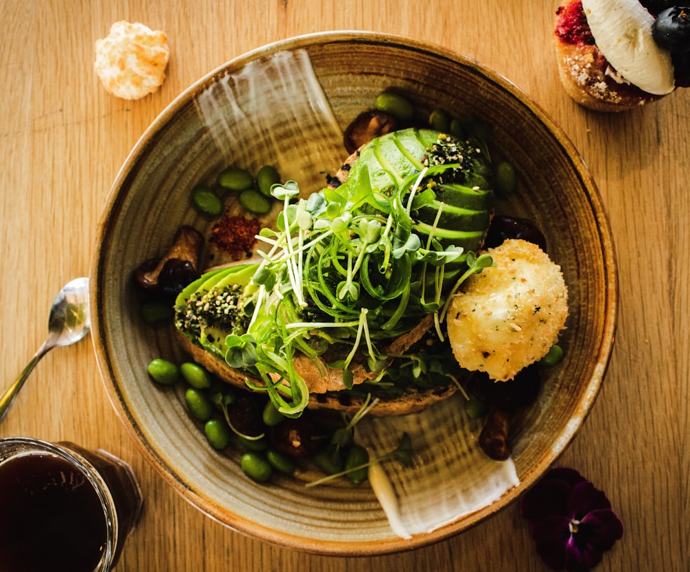 green beans and vegetable salad on brown bowl