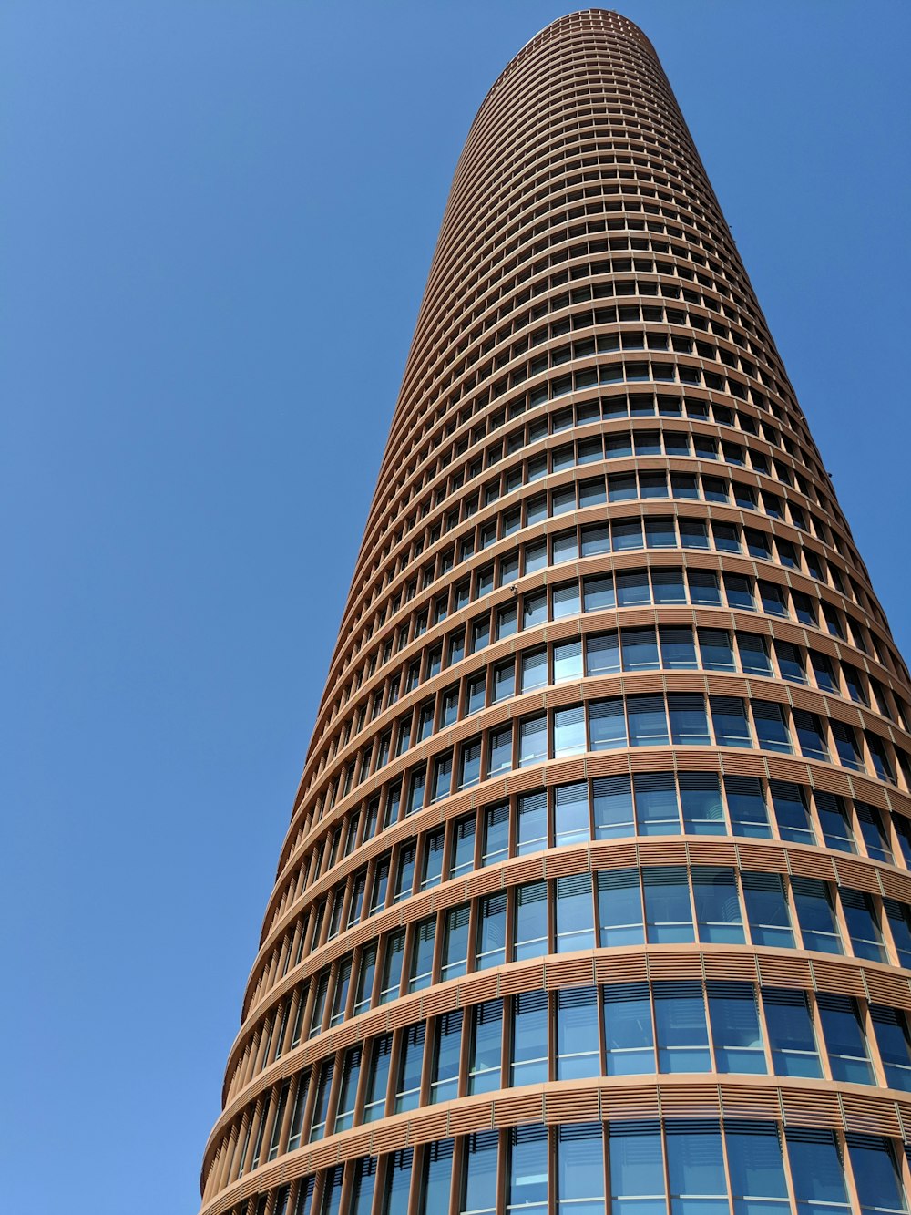 low angle photography of brown high-rise building