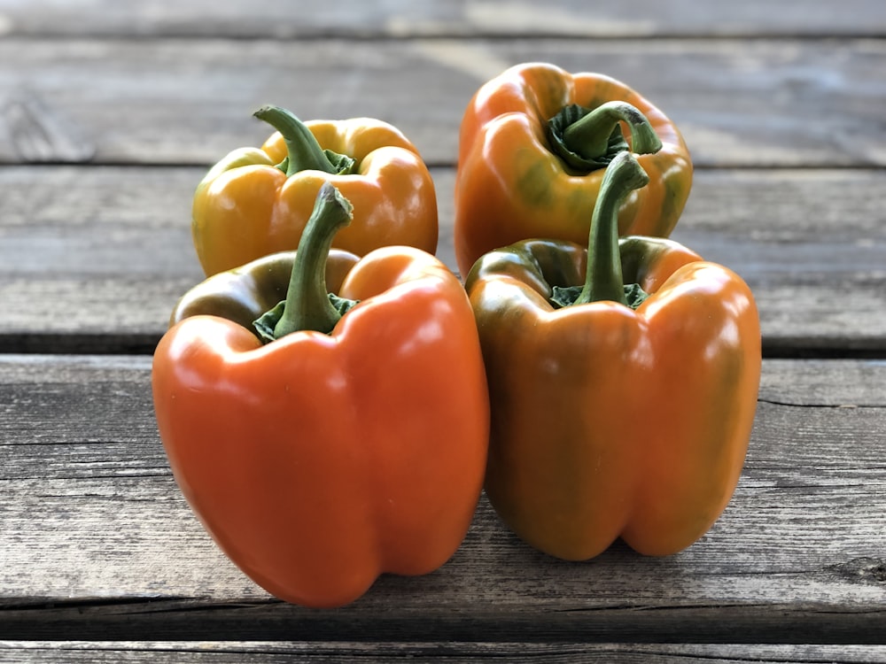 four orange bellpeppers