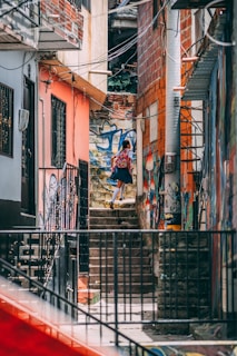 girl wearing uniform walking on stairs during daytime