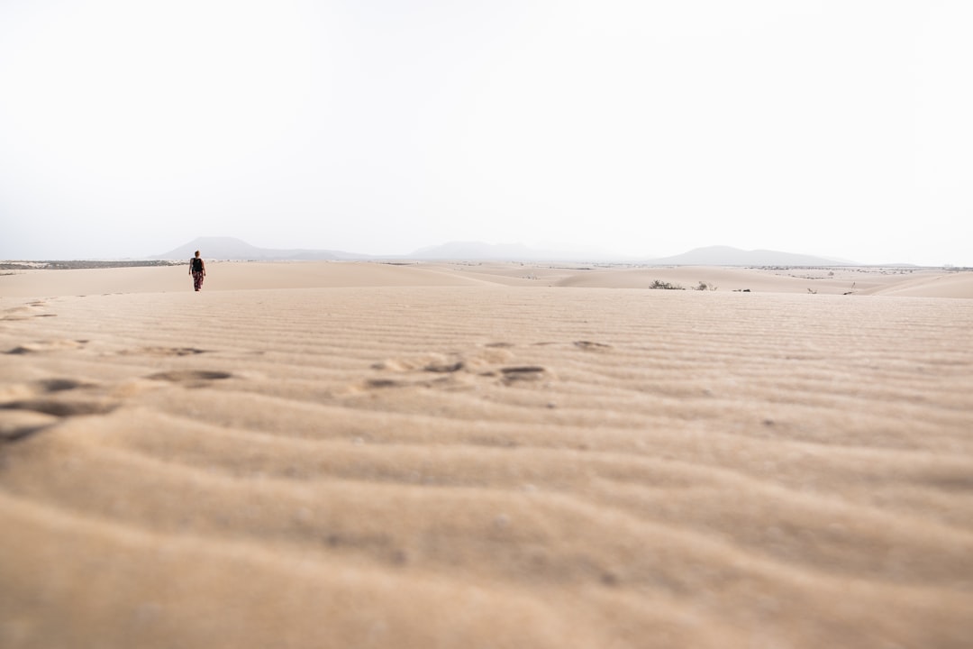 man standing at desert