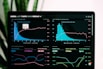 graphs of performance analytics on a laptop screen