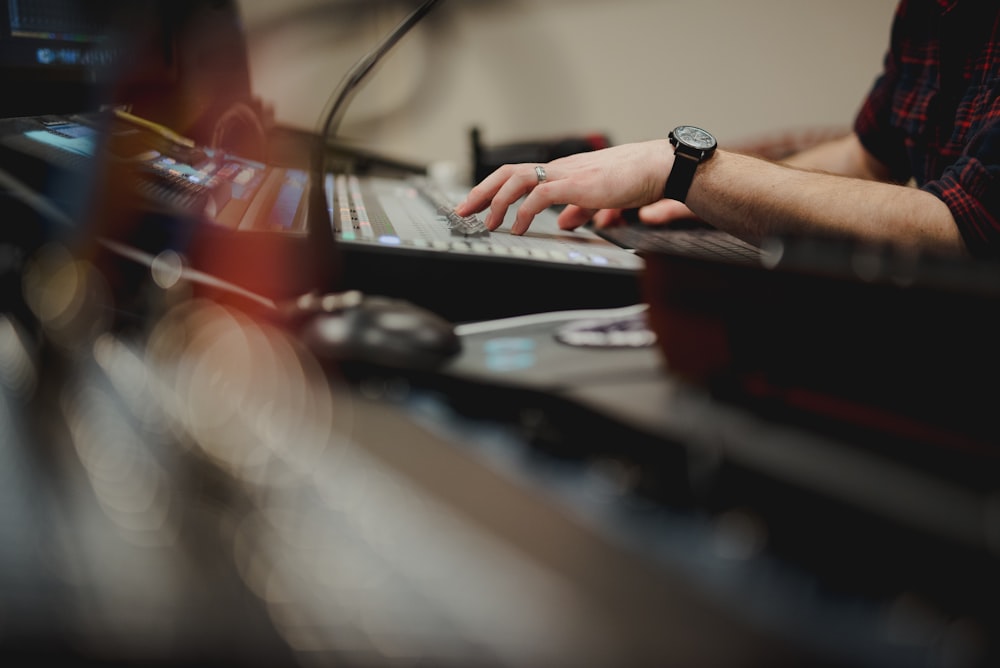 person playing DJ mixer