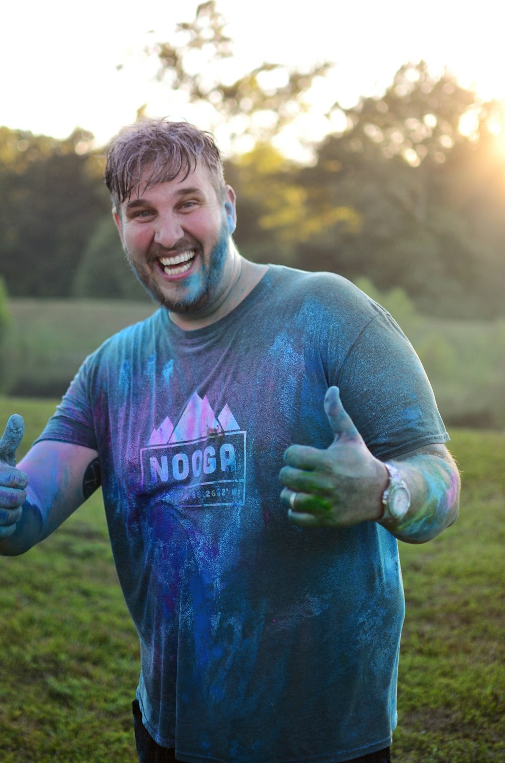 selective focus photography of man with ok hand gesture