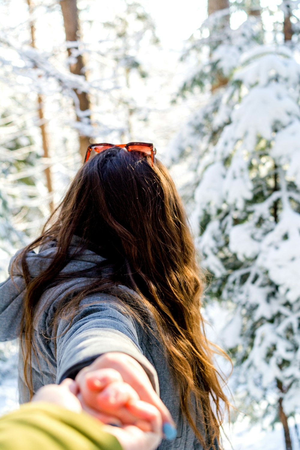 woman standing near pine trees