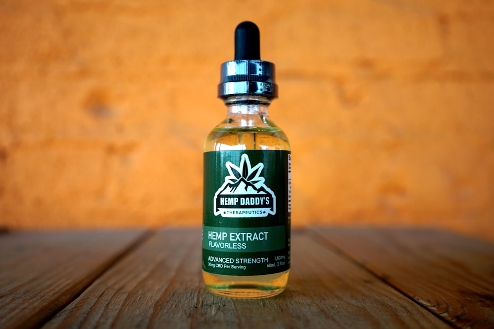 shallow focus photo of vape juice bottle showing front label