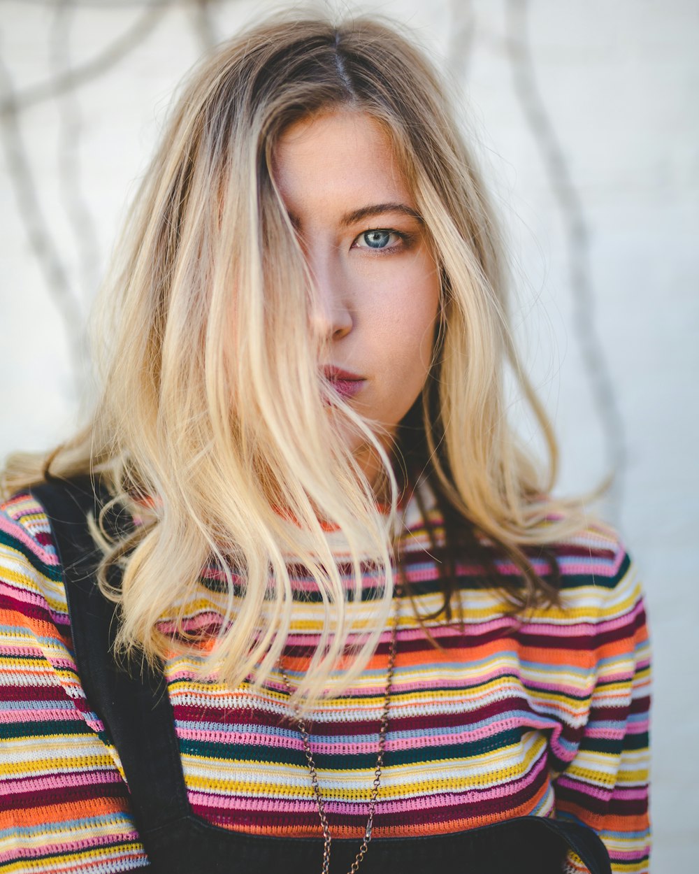 selective focus photography of woman right side face covered with hair