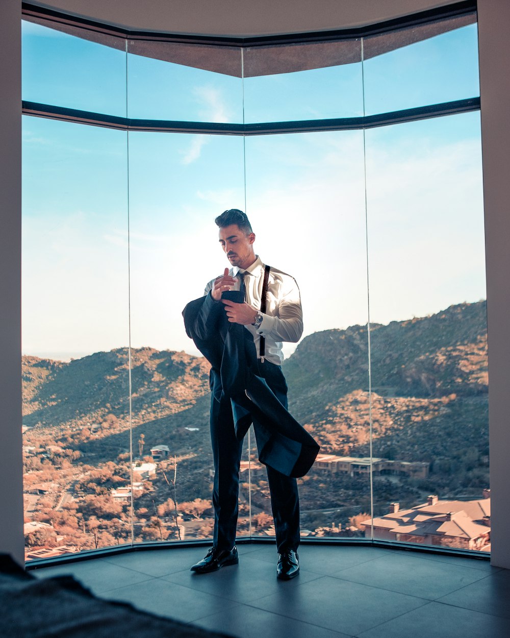 standing man wearing white dress shirt and black dress pants