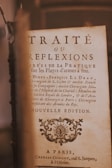 A vintage book page featuring elegant typography with French text. The title 'Traité ou Réflexions' is prominently displayed, followed by detailed information about the author, Henry-François Le Dran, and other academic credentials. The page includes an ornamental design near the bottom and mentions a Parisian publisher, Charles Osmont.