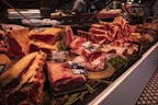 Display of various fresh meat cuts in market