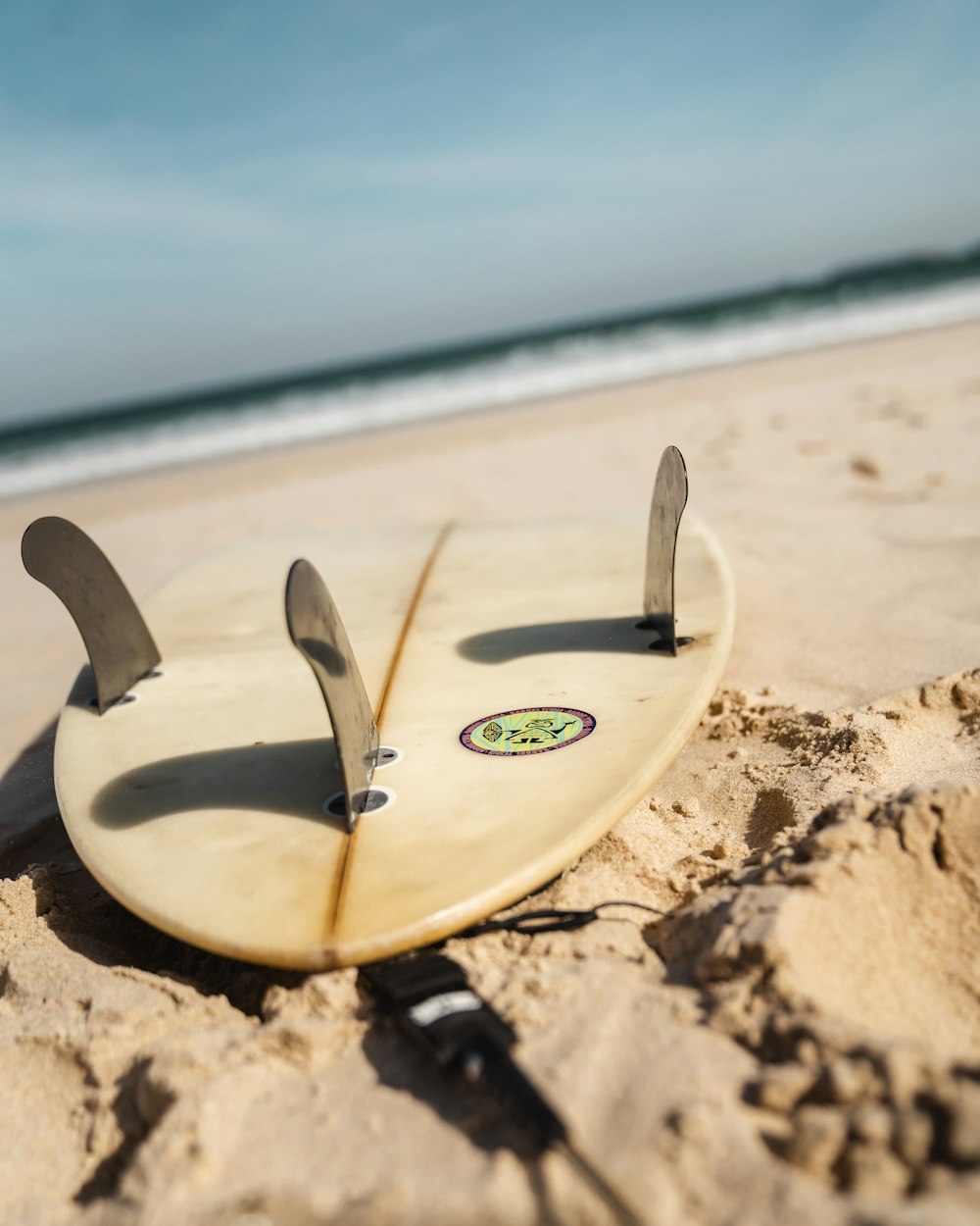 3-tail white surfboard