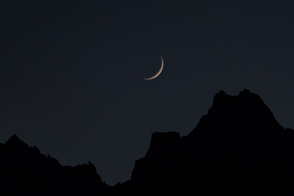 silhouette of mountain during nighttime
