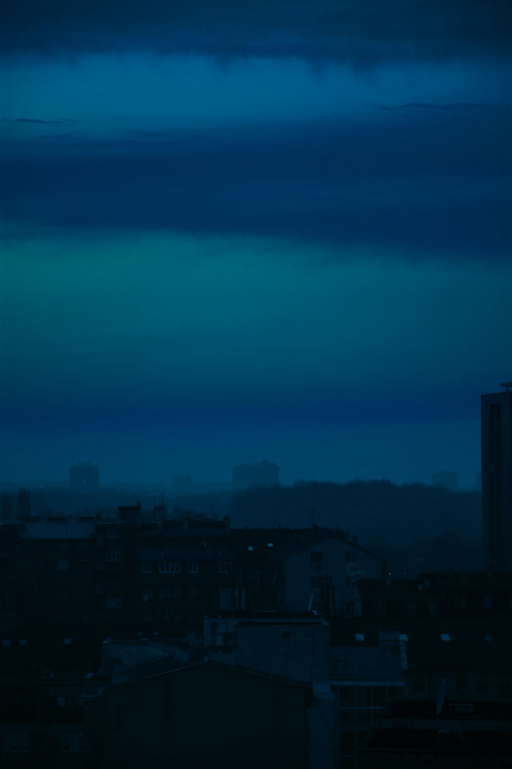 gray city buildings under white sky