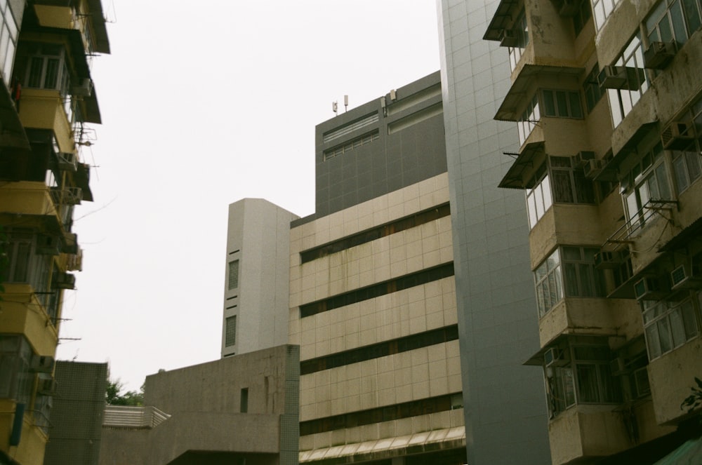 low angle photography of concrete buildings during daytime