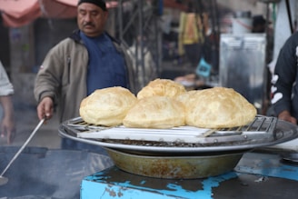 A vibrant street food vendor preparing traditional Colombian arepas.