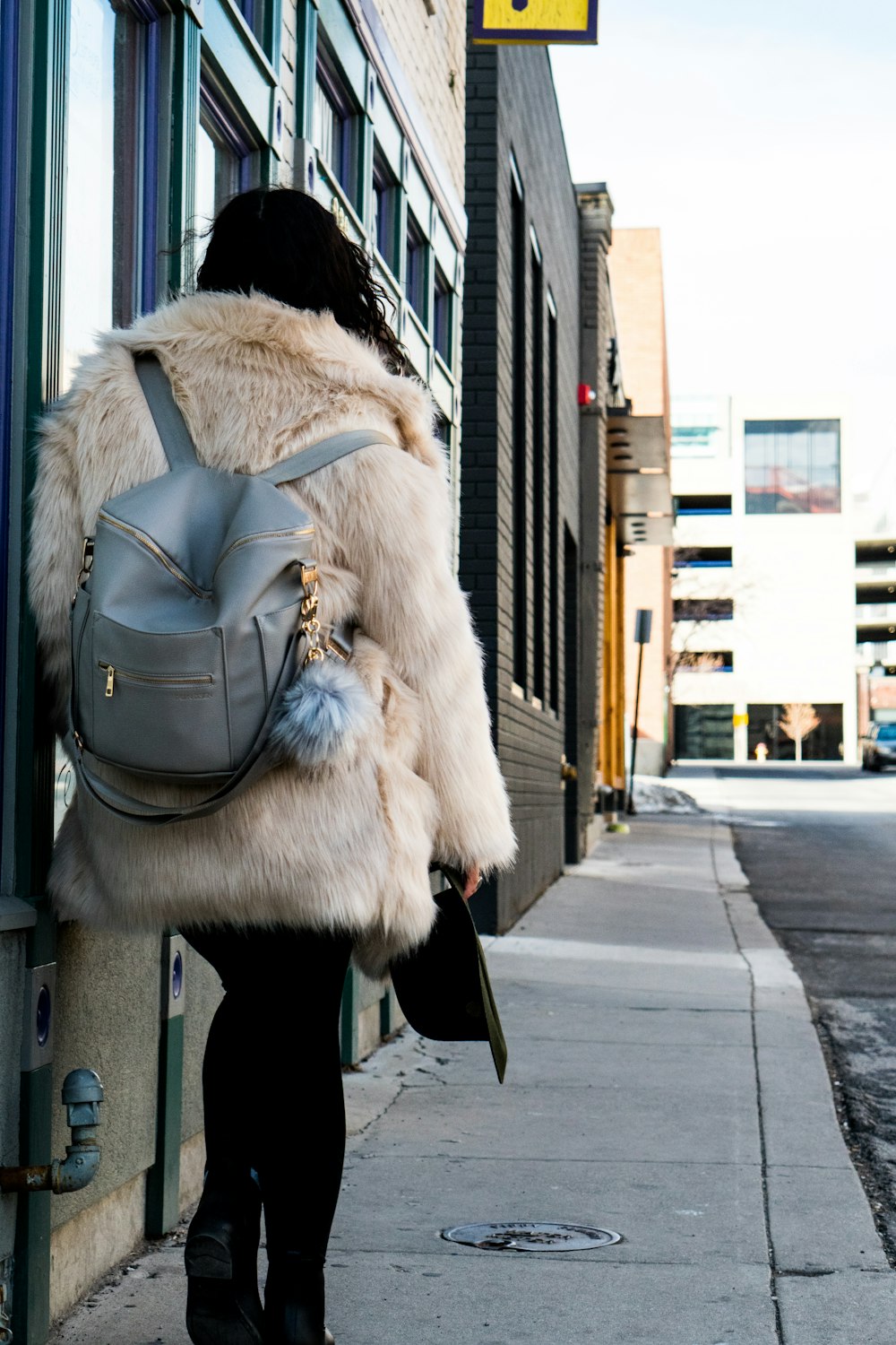 woman carrying backpack