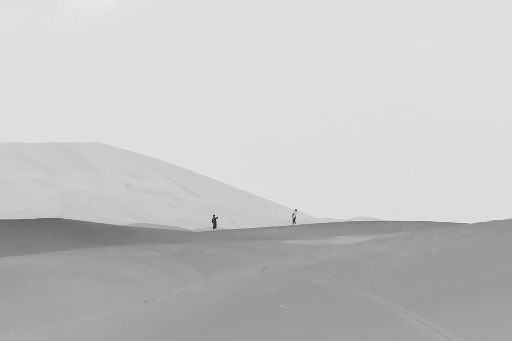 person walking on desert